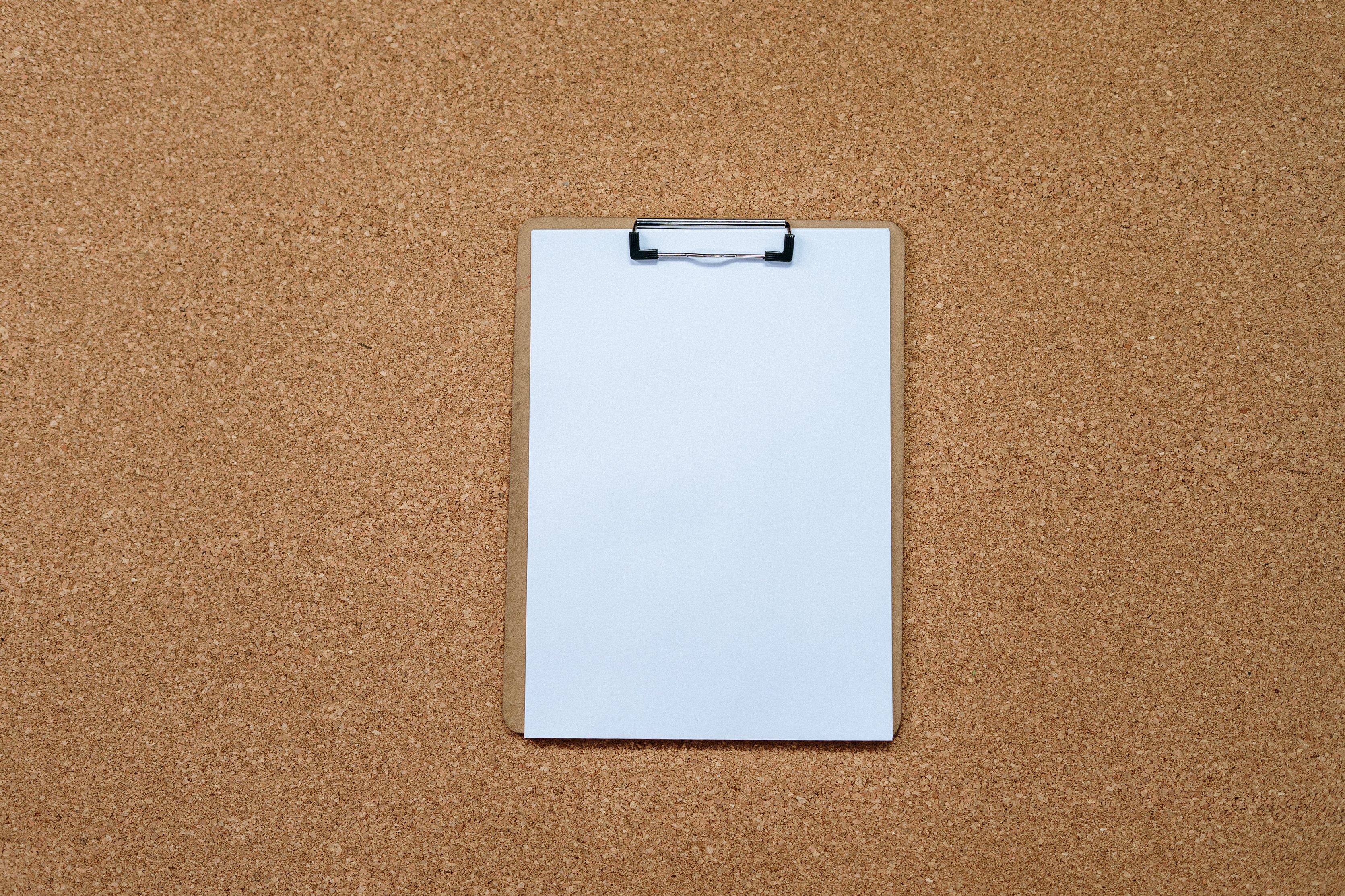 White Rectangular Device on Brown Surface